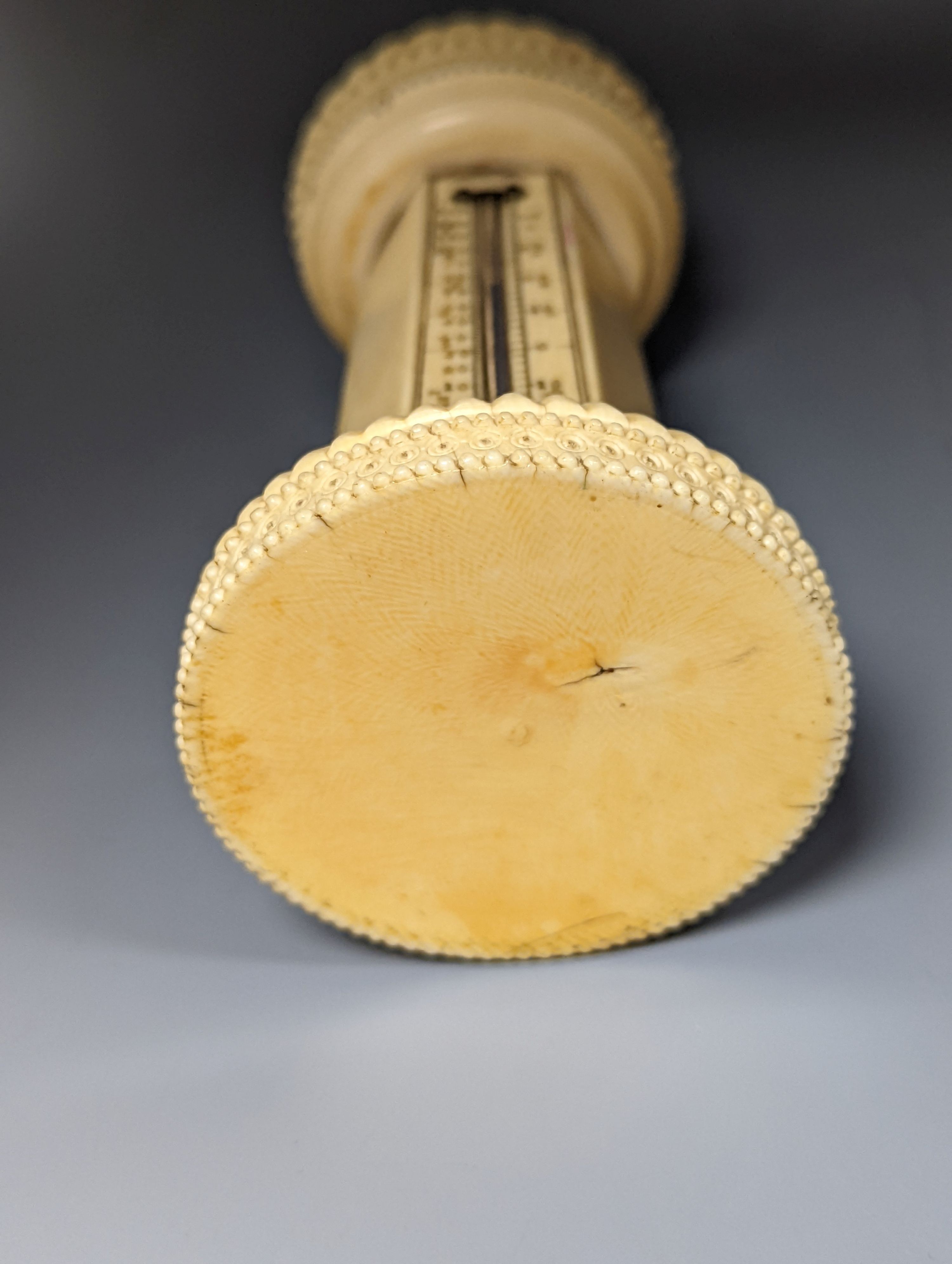 A 19th century ivory table thermometer, 13cm.